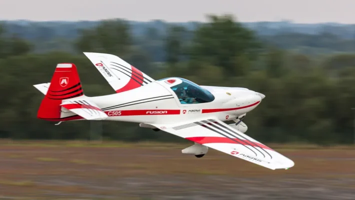 In this image, we see the Magnus Aircraft's Fusion 213, a prime example of cutting-edge aviation technology developed by the Hungarian company, Magnus Aircraft Zrt. The aircraft, which is part of their latest line of electric-powered planes, showcases sleek design and advanced aerodynamics aimed at revolutionizing small aircraft performance and sustainability.