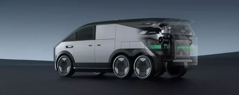 This image illustrates the Xpeng Land Aircraft Carrier (LAC), a six-wheeled hybrid vehicle integrating road and aerial mobility. The design features a sleek, futuristic aesthetic with a modular drone system stored at the rear. This drone, equipped with six foldable rotors, can autonomously transition to flight mode, offering a seamless transformation from ground transportation to air travel